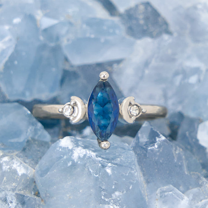 Bague Olivenorma en topaze bleue taille marquise et zircon blanc
