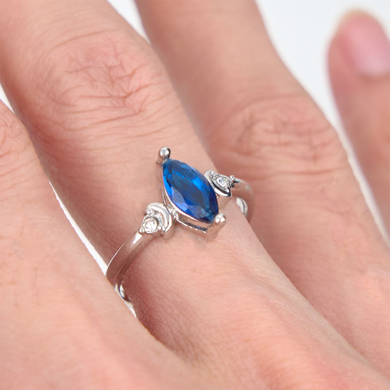 Bague Olivenorma en topaze bleue taille marquise et zircon blanc