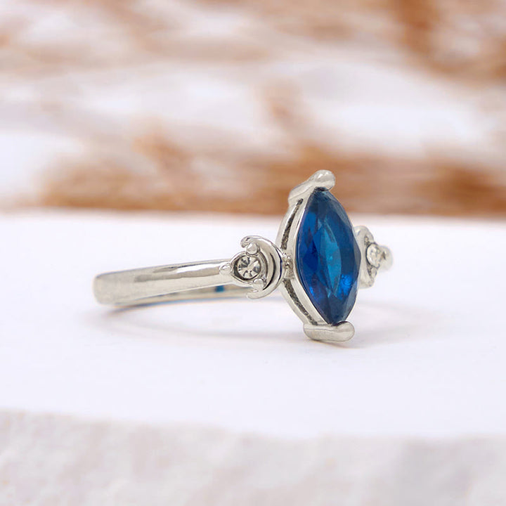 Bague Olivenorma en topaze bleue taille marquise et zircon blanc