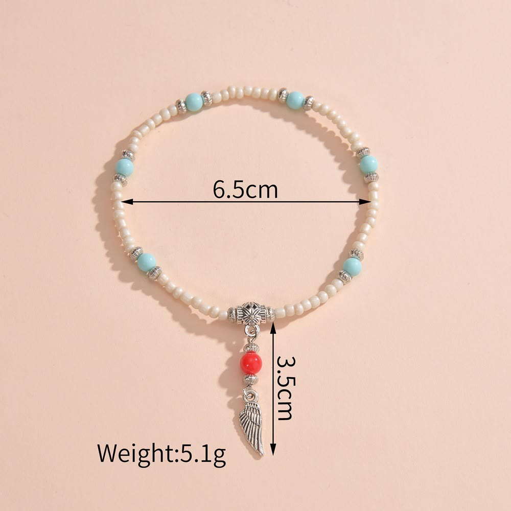 Bracelet de cheville avec pendentif plume en métal et perles turquoise blanches Olivenorma