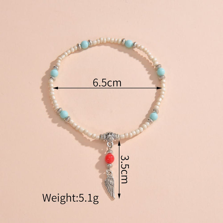 Bracelet de cheville avec pendentif plume en métal et perles turquoise blanches Olivenorma