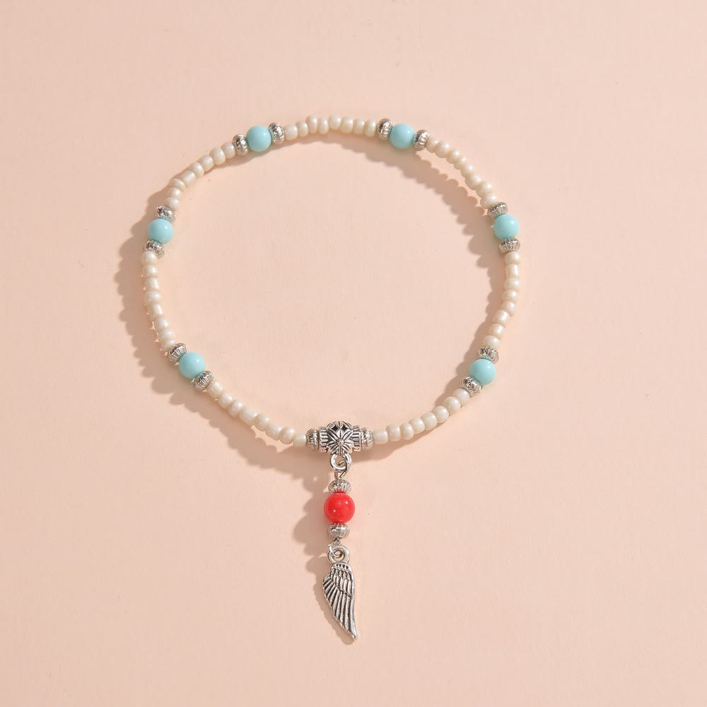 Bracelet de cheville avec pendentif plume en métal et perles turquoise blanches Olivenorma