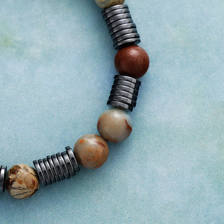 Bracelet Olivenorma en perles d'agalmatolite, d'hématite et d'unakite de 8 mm