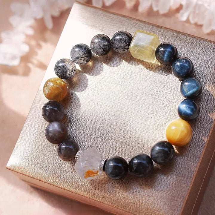 Bracelet en quartz noir rutile et quartz œil de faucon Olivenorma