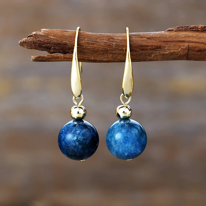 Boucles d'oreilles pendantes en boule de cristal naturel Olivenorma