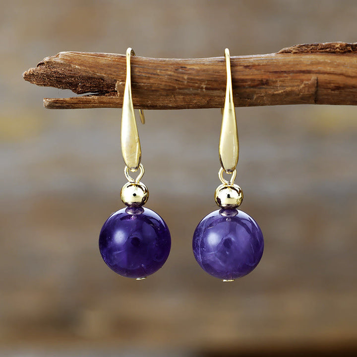 Boucles d'oreilles pendantes en boule de cristal naturel Olivenorma