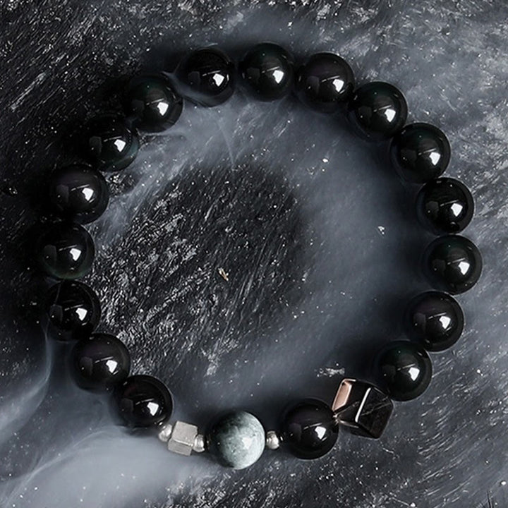 Bracelet en perles d'obsidienne Dark Moon Harsh Sun d' Olivenorma