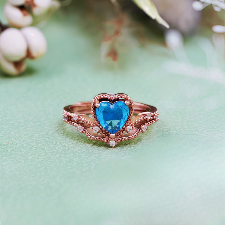 Bague en forme de couronne avec topaze bleue en forme de cœur Olivenorma