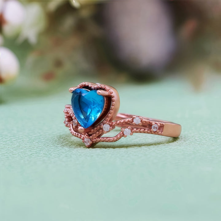 Bague en forme de couronne avec topaze bleue en forme de cœur Olivenorma