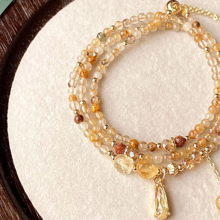 Collier et bracelet en perles de quartz rutile et citrine Olivenorma