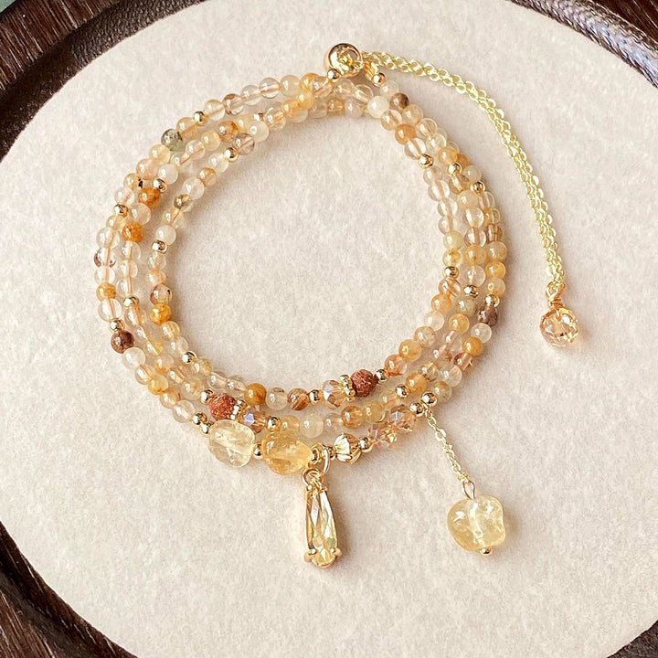 Collier et bracelet en perles de quartz rutile et citrine Olivenorma