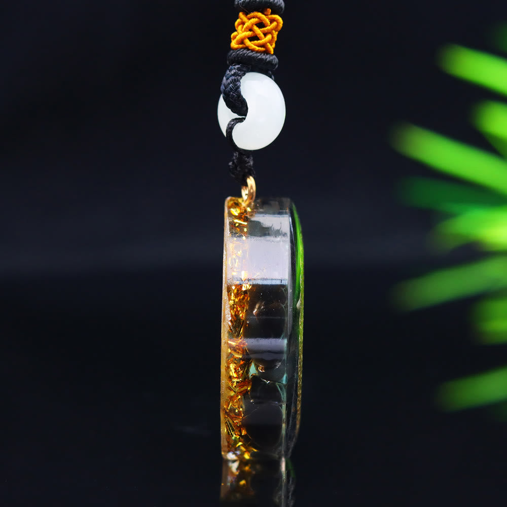 Collier orgonite époxy Olivenorma en onyx noir et turquoise