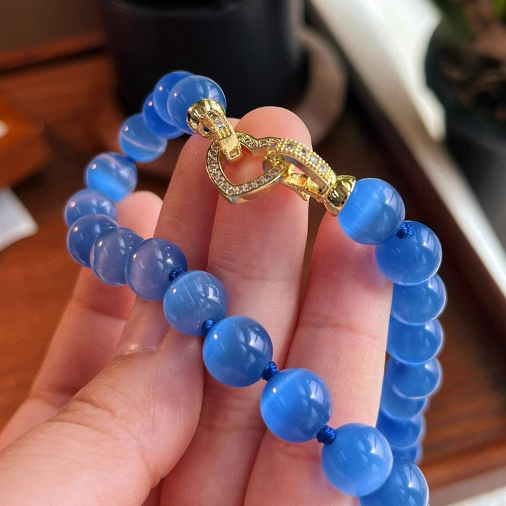 Collier de perles en pierre œil de chat bleu Olivenorma