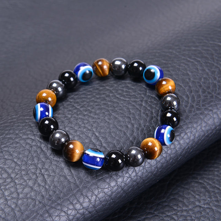 Bracelet Olivenorma en obsidienne, hématite, bleu et rouge, œil de tigre