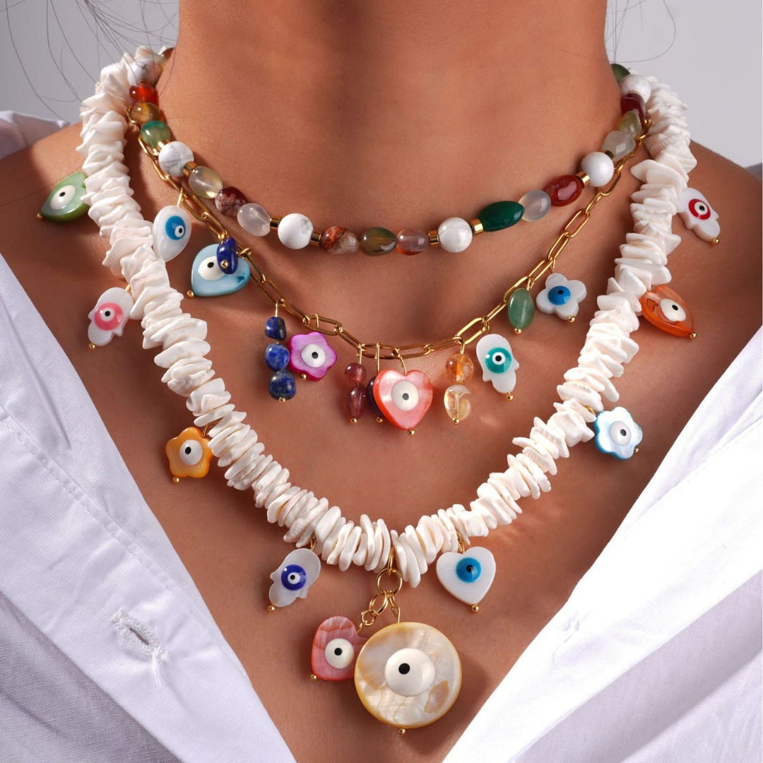 Collier Olivenorma en perles de coquillage en cristal naturel contre le mauvais œil