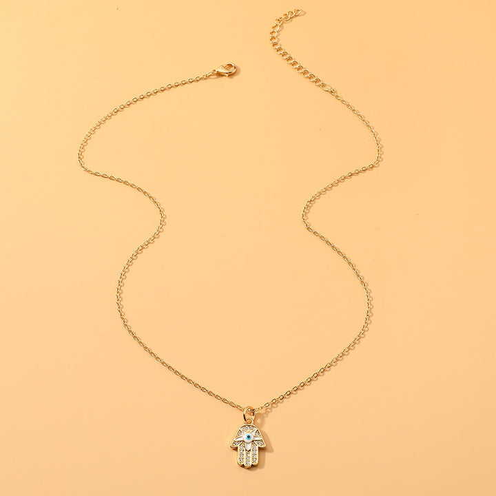 Collier en époxy en forme de cœur avec le mauvais œil Hamsa Olivenorma