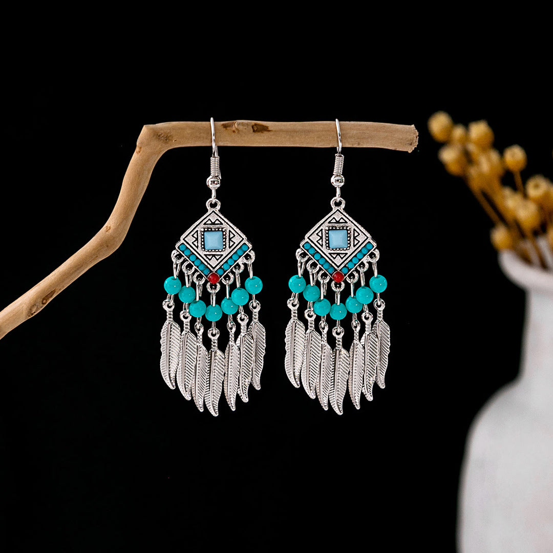 Boucles d'oreilles Olivenorma style ethnique rétro bohème à pampilles turquoise