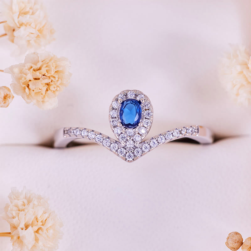 Bague Olivenorma en topaze bleue avec couronne en forme de larme