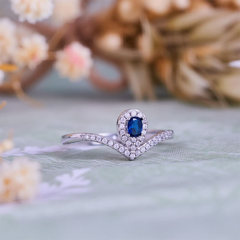 Bague Olivenorma en topaze bleue avec couronne en forme de larme