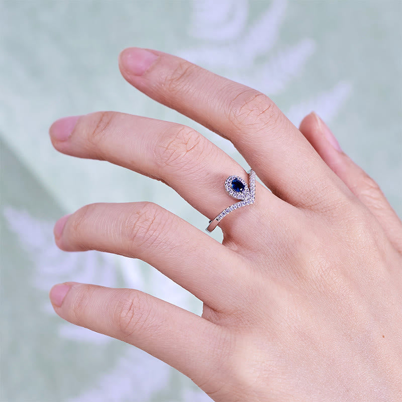 Bague Olivenorma en topaze bleue avec couronne en forme de larme
