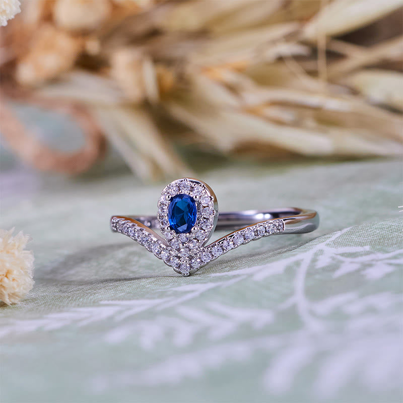 Bague Olivenorma en topaze bleue avec couronne en forme de larme