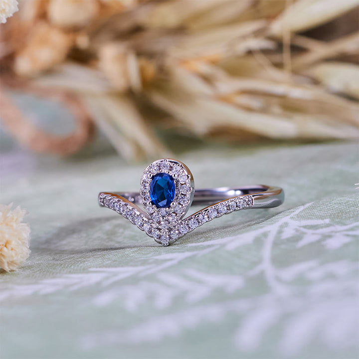 Bague Olivenorma en topaze bleue avec couronne en forme de larme