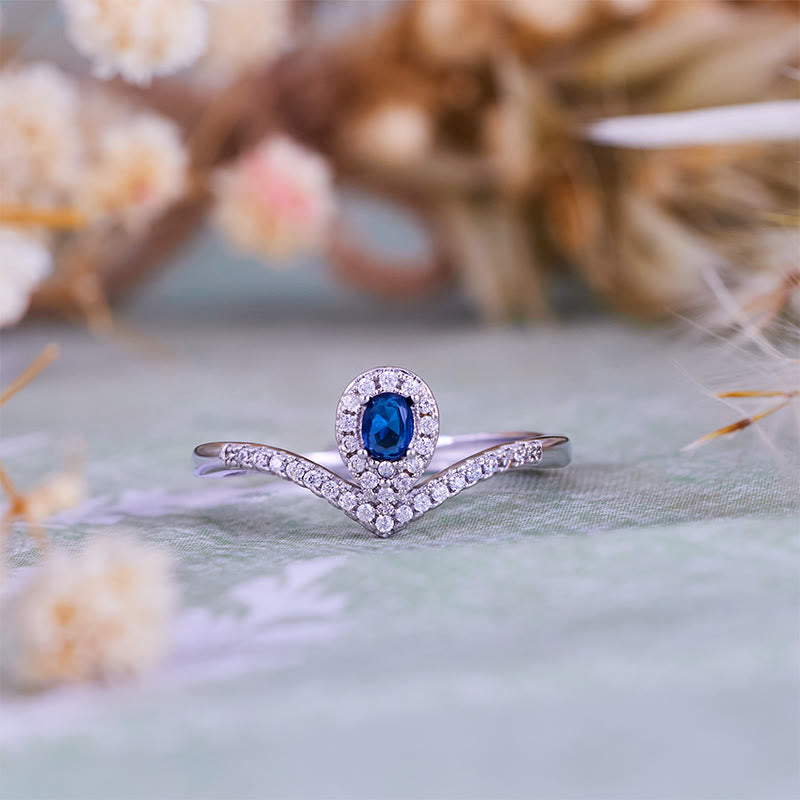 Bague Olivenorma en topaze bleue avec couronne en forme de larme