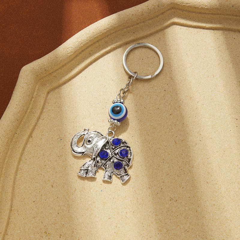 Porte-clés créatif Olivenorma avec mauvais œil bleu et détails animaux/plantes - Éléphant - image 7
