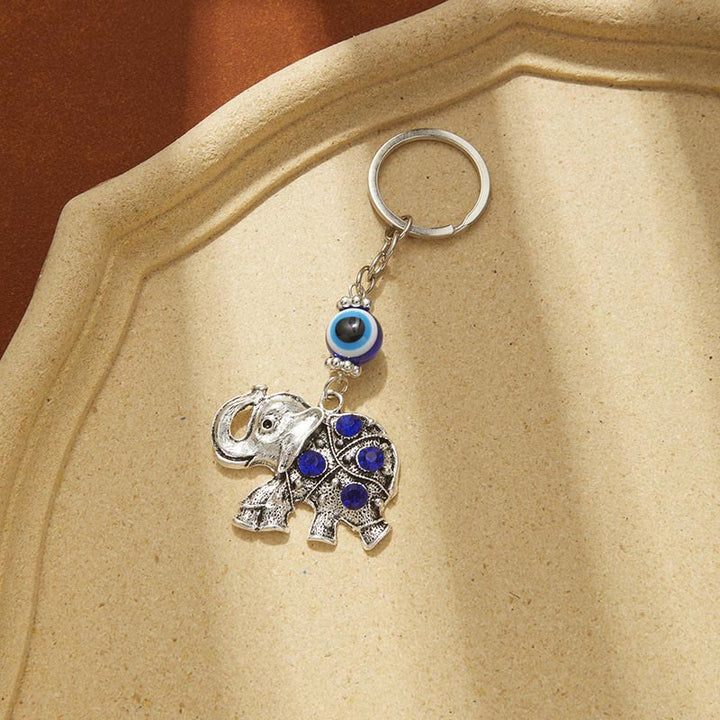 Porte-clés créatif Olivenorma avec mauvais œil bleu et détails animaux/plantes - Éléphant - image 7