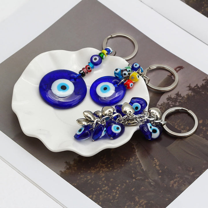 Porte-clés Olivenorma en forme de cœur bleu vibrant avec plusieurs breloques - image 15