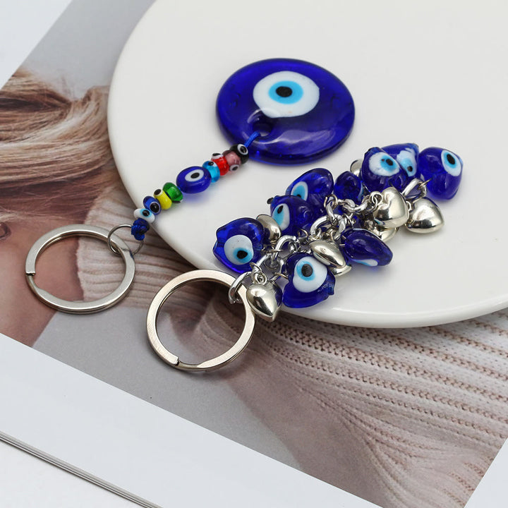 Porte-clés Olivenorma en forme de cœur bleu vibrant avec plusieurs breloques - image 14