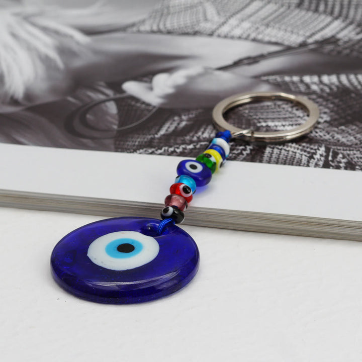 Porte-clés Olivenorma en forme de cœur bleu vibrant avec plusieurs breloques - image 1