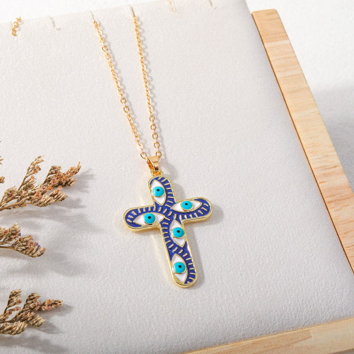 Collier Croix Mauvais Œil Olivenorma « Nous sommes protégés »