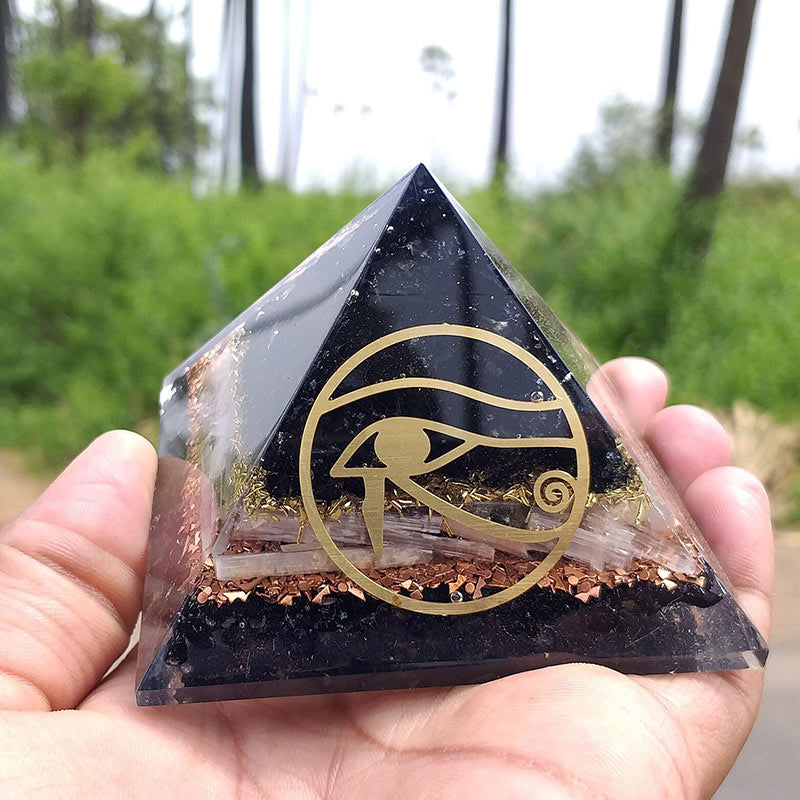 Pyramide d'orgone de protection en obsidienne Olivenorma Oeil d'Horus