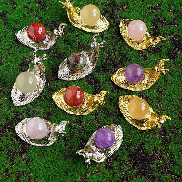 Support de boule de cristal naturel Olivenorma, petite décoration en pierre précieuse en forme d'escargot