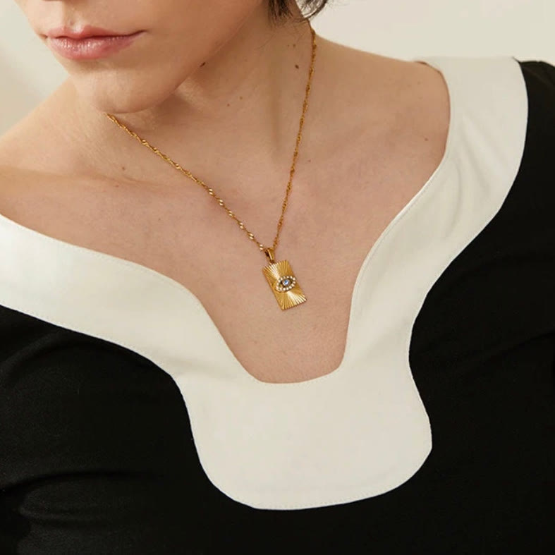 Collier Olivenorma avec topaze bleue et zircon blanc mauvais œil