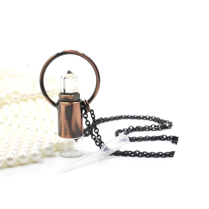 Pendentif bouteille de parfum en cristal naturel prismatique Olivenorma