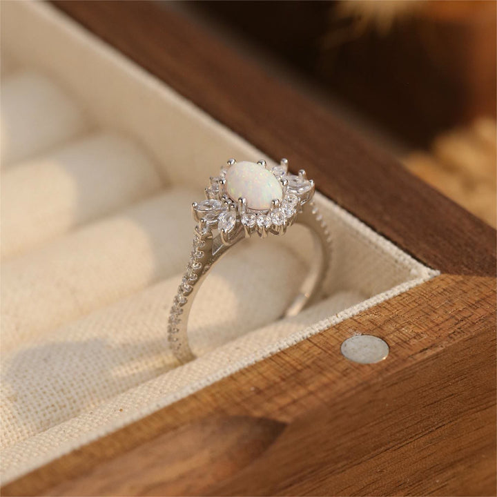 Bague en argent 925 avec motif tournesol et opale blanche et bleue Olivenorma