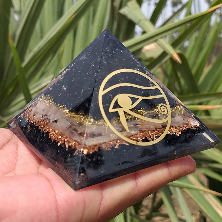Pyramide d'orgone de protection en obsidienne Olivenorma Oeil d'Horus