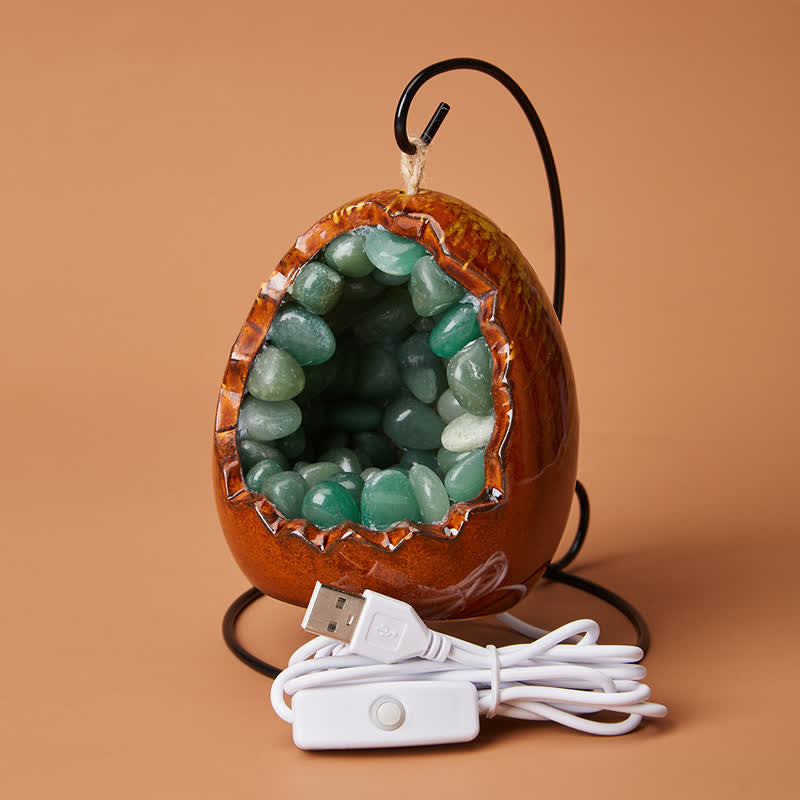 Décoration de grotte en cristal avec pierre précieuse en forme d'œuf de dinosaure Olivenorma