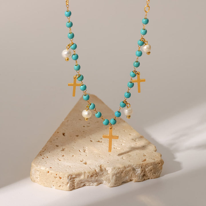 Collier à pampilles avec pendentif en croix et perles turquoise Olivenorma