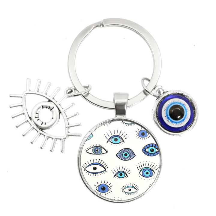Porte-clés en époxy bleu mauvais œil Hamsa Olivenorma