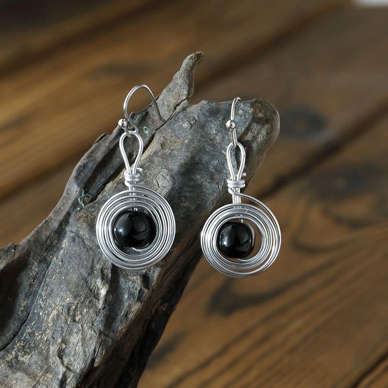Boucles d'oreilles créoles infinies en fil de fer punk en obsidienne Olivenorma