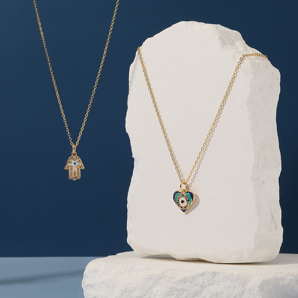 Collier en époxy en forme de cœur avec le mauvais œil Hamsa Olivenorma