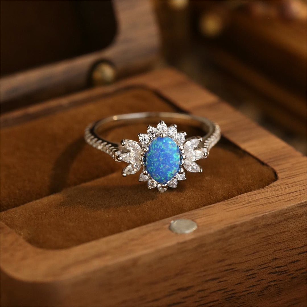 Bague en argent 925 avec motif tournesol et opale blanche et bleue Olivenorma
