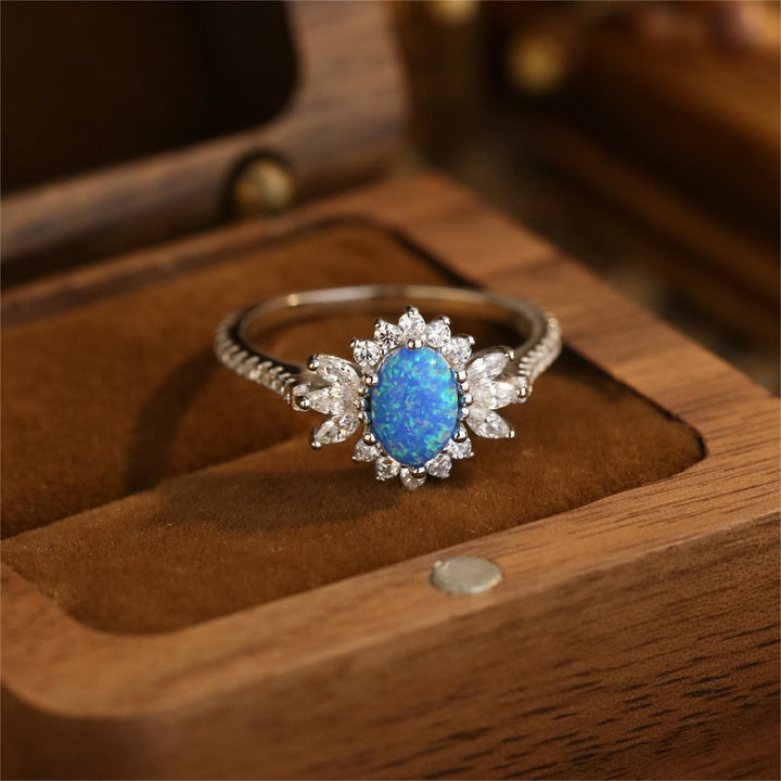 Bague en argent 925 avec motif tournesol et opale blanche et bleue Olivenorma