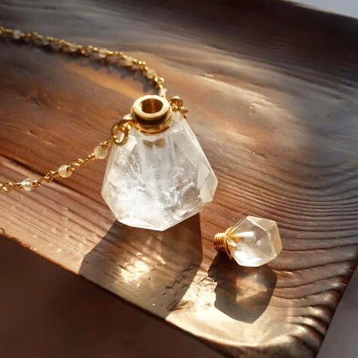 Collier bouteille de parfum en cristal