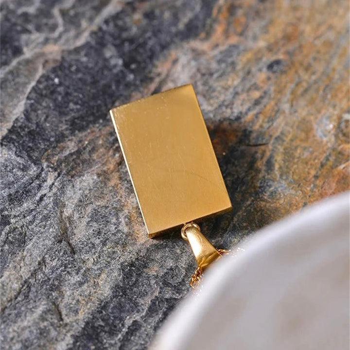 Collier Olivenorma avec topaze bleue et zircon blanc mauvais œil