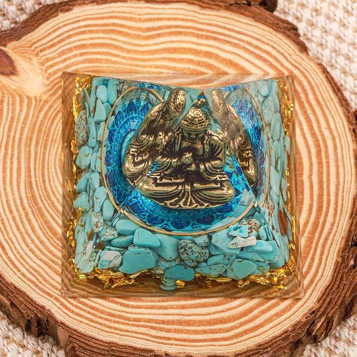Bouddha Olivenorma avec pyramide orgone d'équilibre turquoise naturelle
