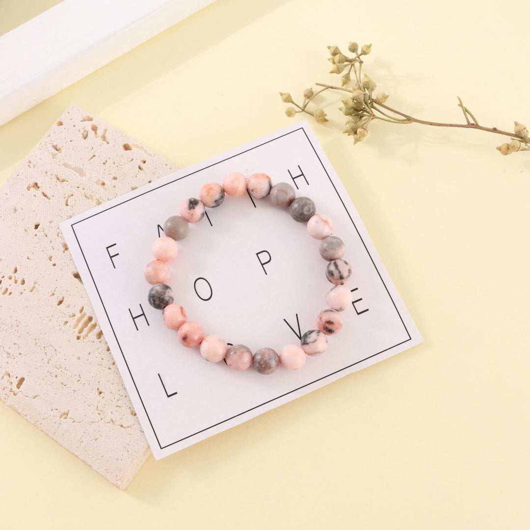 Bracelet de perles fait main en pierre zébrée rose rhodochrosite Olivenorma de 8 mm